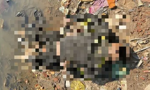 Phát hiện thi thể người đàn ông đeo khẩu trang dưới cằm nằm ngửa bên bờ sông