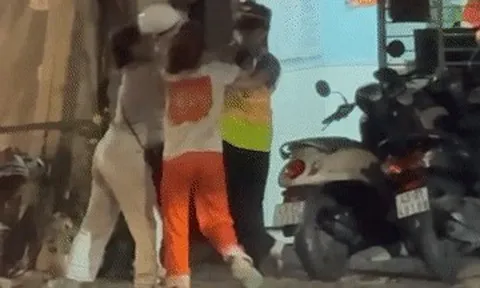 Cố vượt rào chắn, người phụ nữ còn quay lại hành hung nhân viên đường sắt