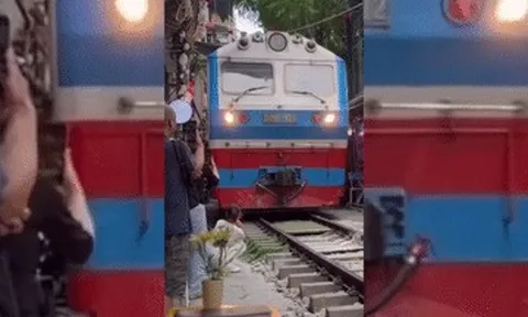 Xác minh clip cô gái bị tàu hỏa hất văng điện thoại ở 'phố cà phê đường tàu'